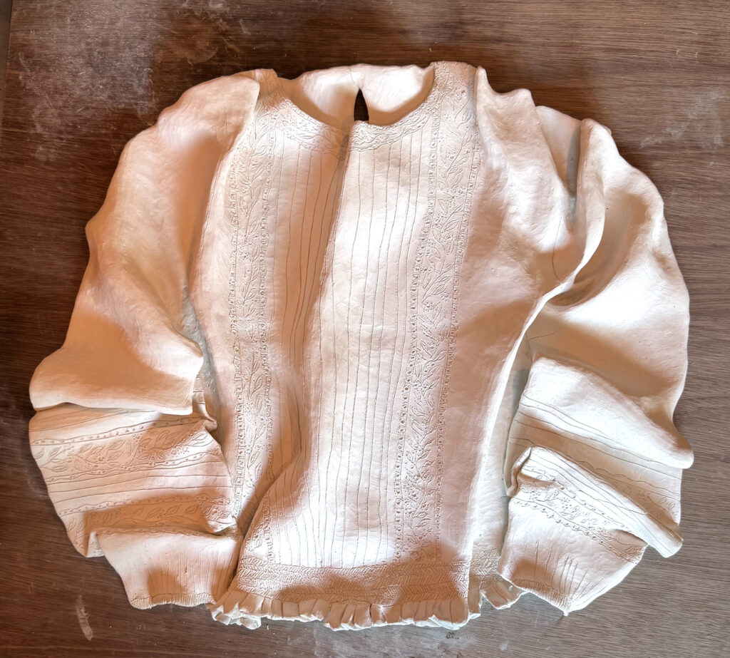 Lace Blouse in white stoneware, bisque fired